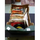 A tray of 45 RPM records by various artists