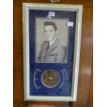 A framed and glazed print of Elvis Presl