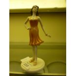 A Coalport figure of a fashionable lady