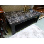 A faux marble topped coffee table on bla