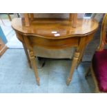 A yew veneered console table