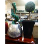 Two plastic plants in pots