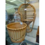 A dolls wicker chair together with a dol