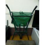 A metal framed folding wheelbarrow