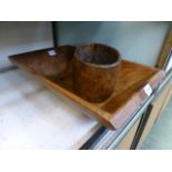 A carved wooden trough together with a c