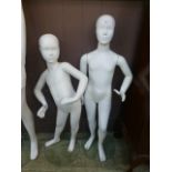 Two child mannequins on stands