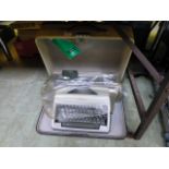An Olympia typewriter in case