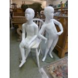 Two child mannequins, one on stand the o