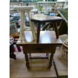 A single drawer occasional table along w