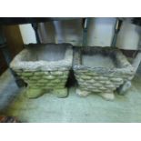 A pair of composite stone garden planter