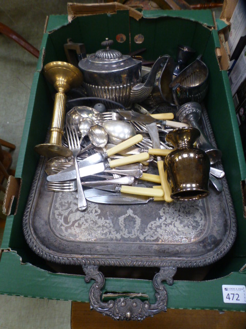 A tray containing an assortment of silve