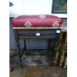 An Edwardian walnut music stool, the uph