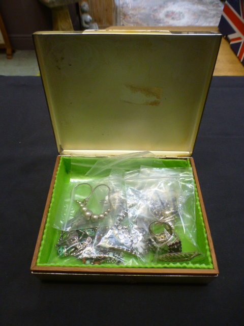 A jewellery box containing silver jewell