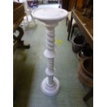 A white painted jardiniere stand with ro