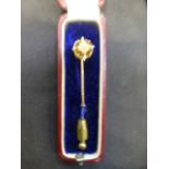 A boxed Victorian yellow metal pin marke