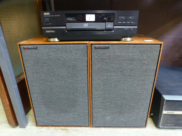 An Akai CD player with two Bush speakers