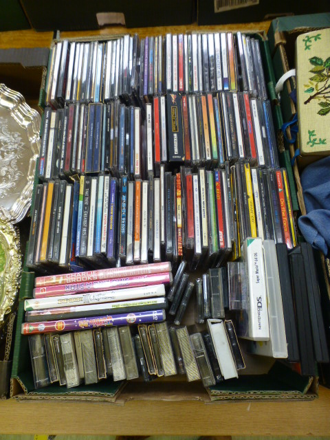 A tray containing CDs, DVDs and cassette