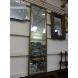 A gilt framed rectangular mirror