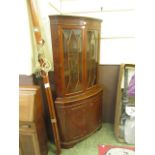 A reproduction yew veneered corner cabin