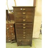 An early 20th century oak twelve drawer