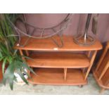 A light Ercol elm three tier stand