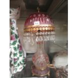 A glass lamp having a gilt mounted shade