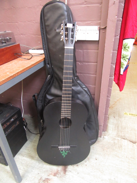 A black acoustic guitar