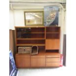 A mid-20th century teak wall unit with g