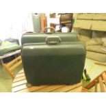 Two green Samsonite hard cases