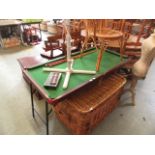 A child's pool table with cues and balls