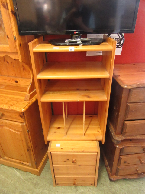 A modern pine storage cabinet with open