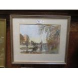 A framed and glazed water colour of lake