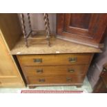 An early 20th century oak three drawer c
