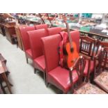 A set of six red upholstered high back m