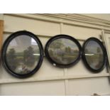 Three black painted oval framed and glaz
