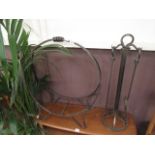 A wrought iron log basket together with