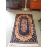 A blue and gold ground rug