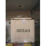 A cream and green enamelled bread bin