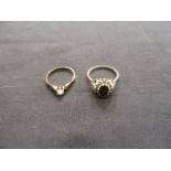 A 9ct gold garnet and white stone cluste