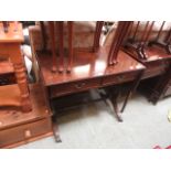A reproduction mahogany sofa table