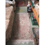 A Chinese pink ground rug