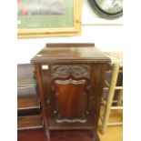 An early 20th century walnut bedside pot