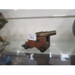 A miniature brass cannon