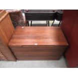 A teak hinge-top Ottoman