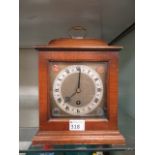 A walnut cased bracket clock having coin