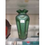 A hand blown green iridescent glass vase
