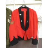 A red and black military jacket and trou