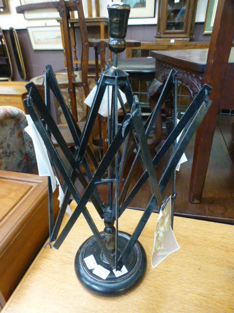 A wool winder on stand with old photogra