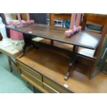 A mahogany topped coffee table