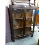 An early 20th century oak bookcase, the